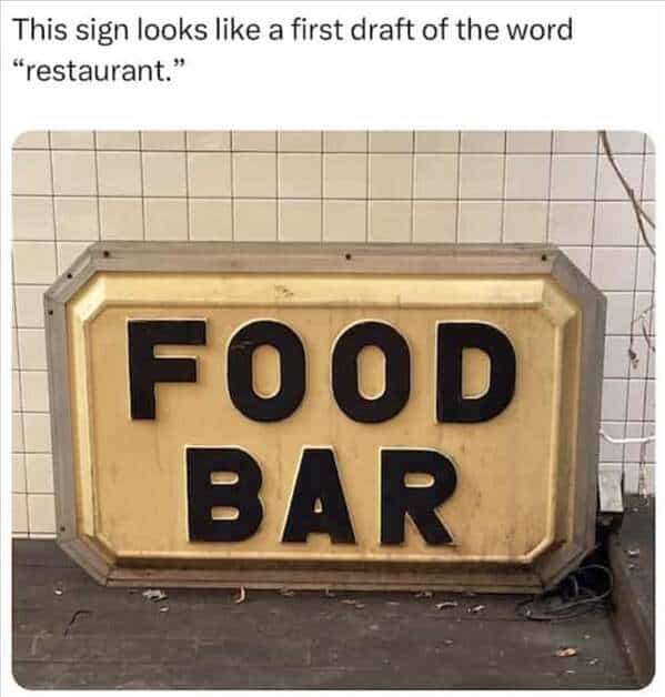 This sign looks like a first draft of the word "restaurant." FOOD BAR