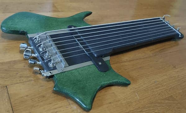 cursed instruments, instruments with threatening auras, weird instruments, instrument fails, bizarre music, odd instruments, performance art, music gadgets, funny instrument photos, experimental music, custom instruments, music humor, instrument design, odd musical gear, creepy instruments