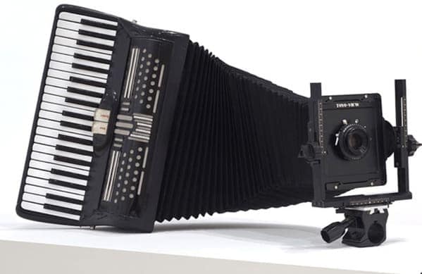 cursed instruments, instruments with threatening auras, weird instruments, instrument fails, bizarre music, odd instruments, performance art, music gadgets, funny instrument photos, experimental music, custom instruments, music humor, instrument design, odd musical gear, creepy instruments