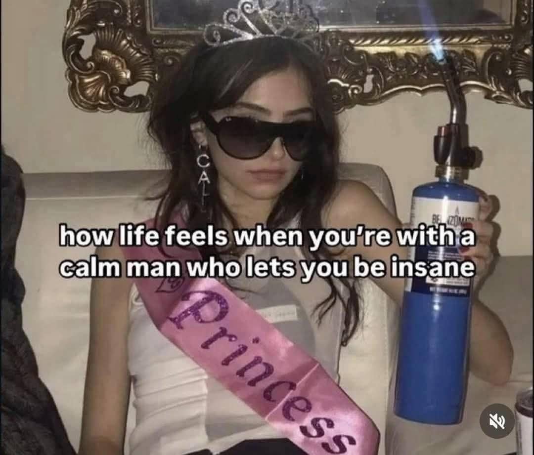 Young woman wearing a princess sash and tiara holding a blowtorch with sunglasses on.