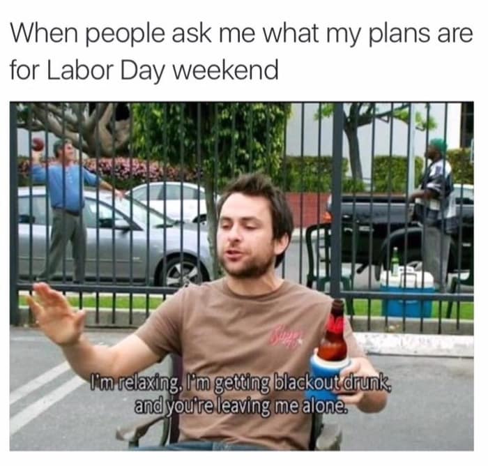 Charlie Day sits in a lawn chair holding a beer, speaking emphatically.