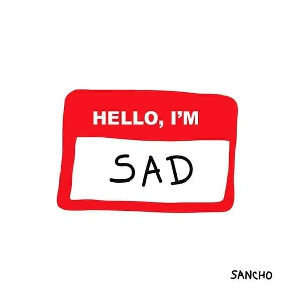 Red hello my name is badge that reads hello I’m sad