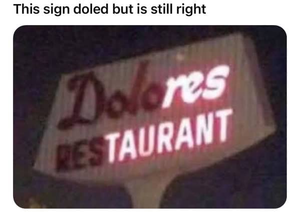 Flickering Dolores restaurant sign still spells restaurant