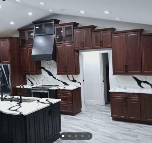 A kitchen renovation fail where new cabinets have been installed directly over a doorway.