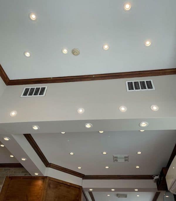 A construction fail of a ceiling that has a chaotic and excessive number of pot lights.