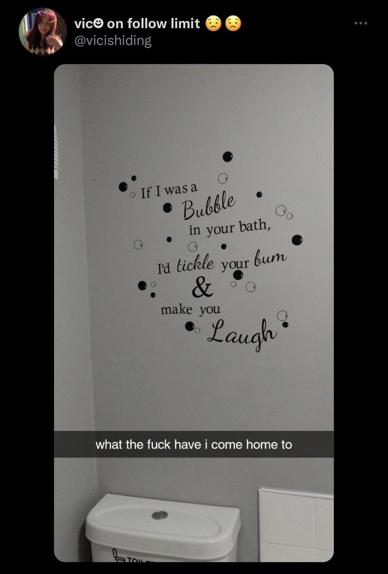 A photo of a bathroom that has a very cringey and slightly inappropriate poem as a vinyl wall decal, which reads, "If I was a bubble in your bath, I'd tickle your bum & make you laugh."