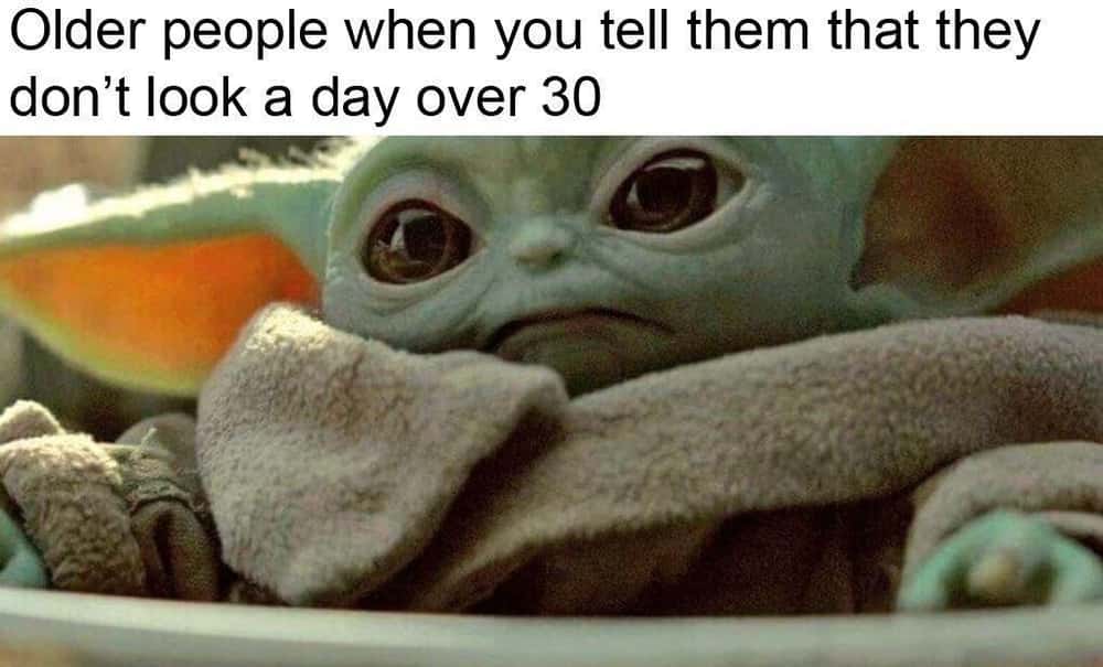 A funny Mandalorian and Grogu meme using a grumpy Grogu to show how older people react to compliments