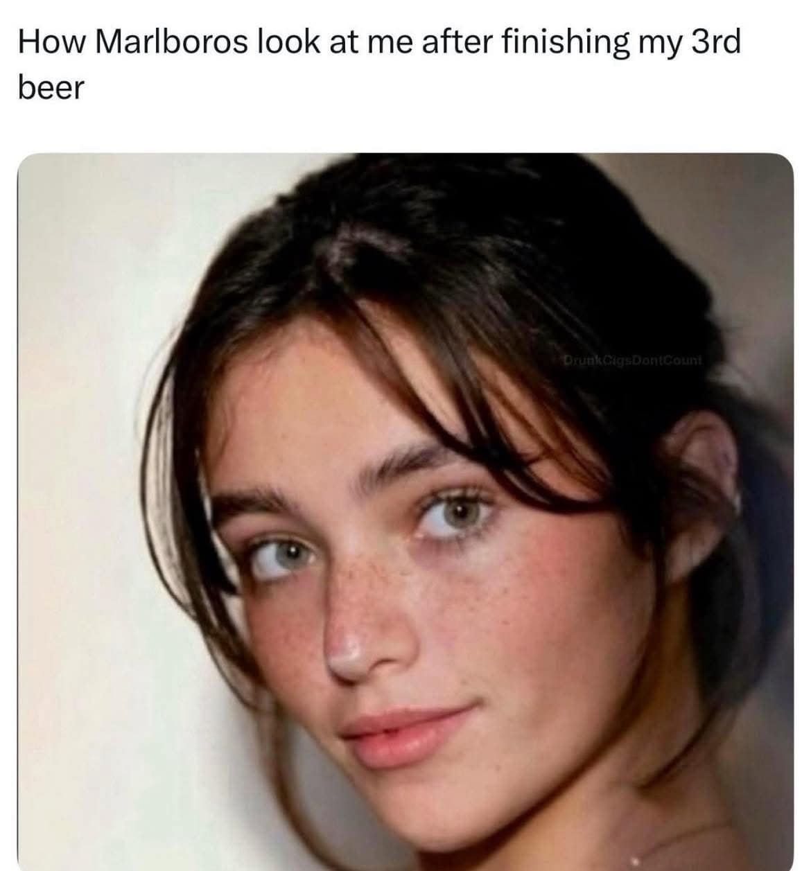 Soft-lit portrait of a freckled woman; caption reads “How cigarettes look at me after finishing my 3rd beer.”