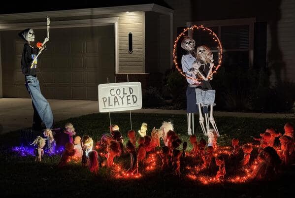 A hilarious meme of a Halloween skeleton display that is set up to look like a Coldplay concert.