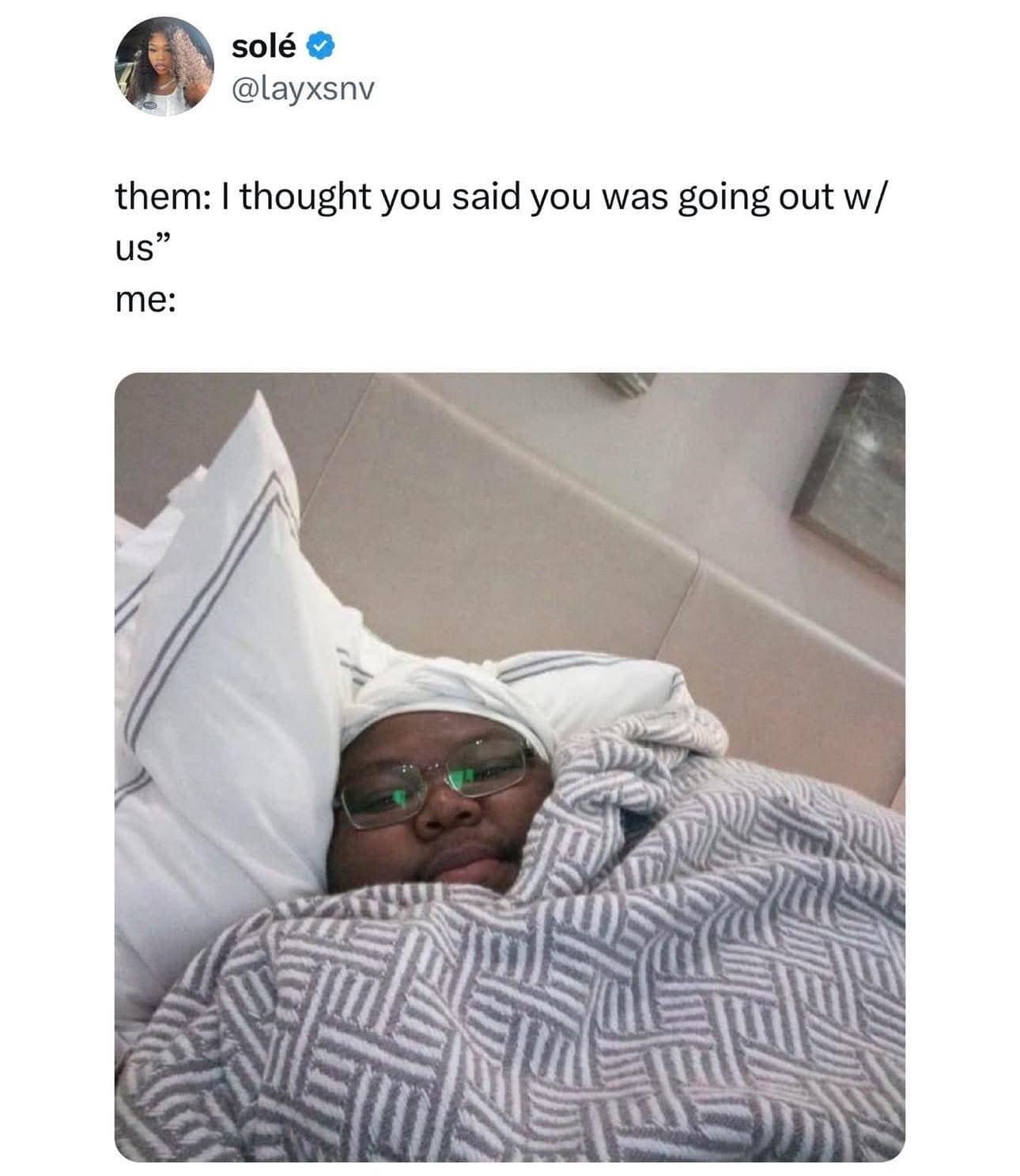 A funny meme showing a person comfortably tucked in bed, representing someone who has bailed on plans to go out with friends.