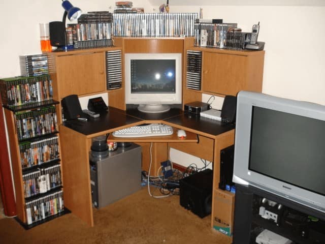 Peak early 2000s computer desk nostalgic pic with CRT monitor and CD towers