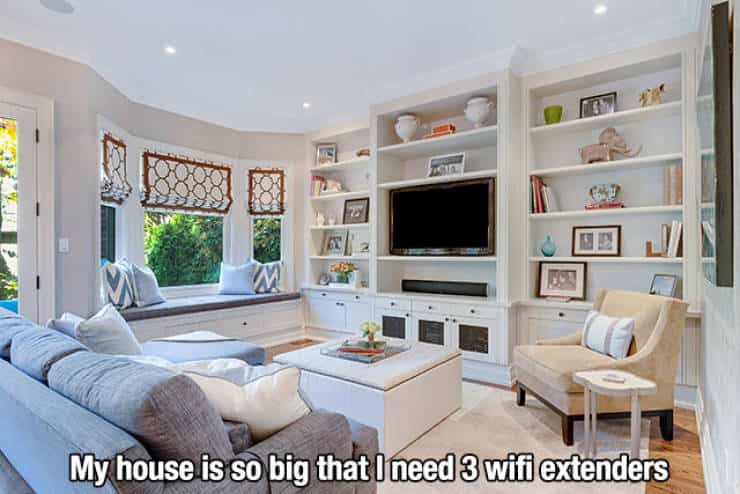 Large luxury living room with a caption about needing multiple WiFi extenders.
