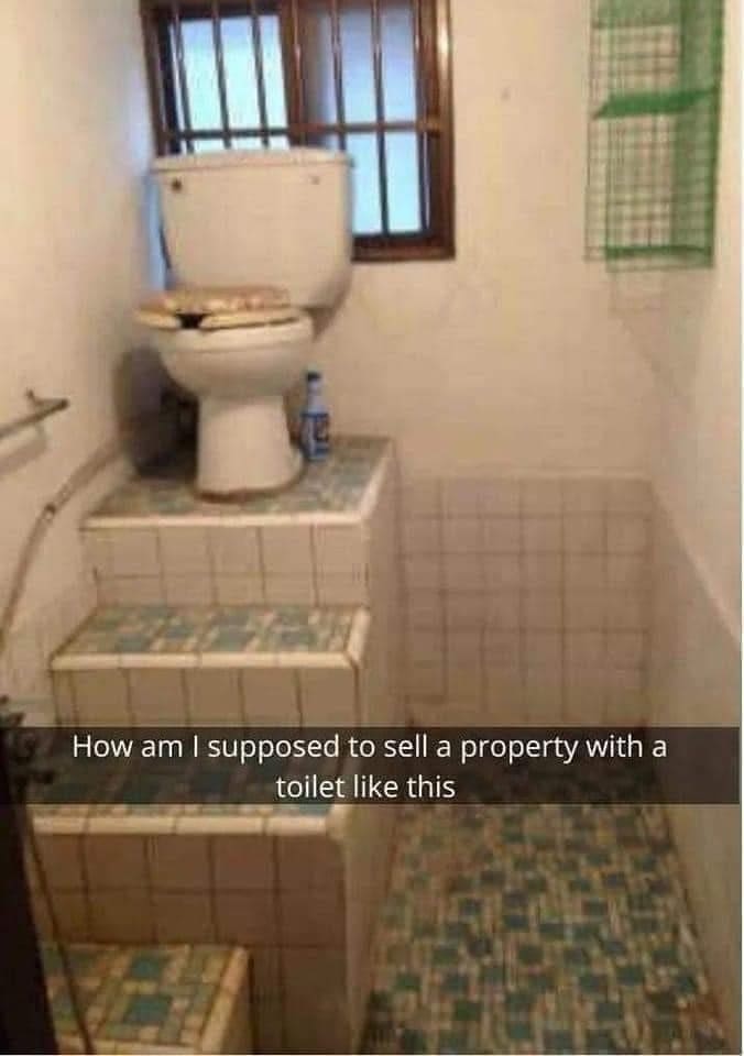 Bizarre bathroom design featuring a toilet installed at the very top of tiled stairs.
