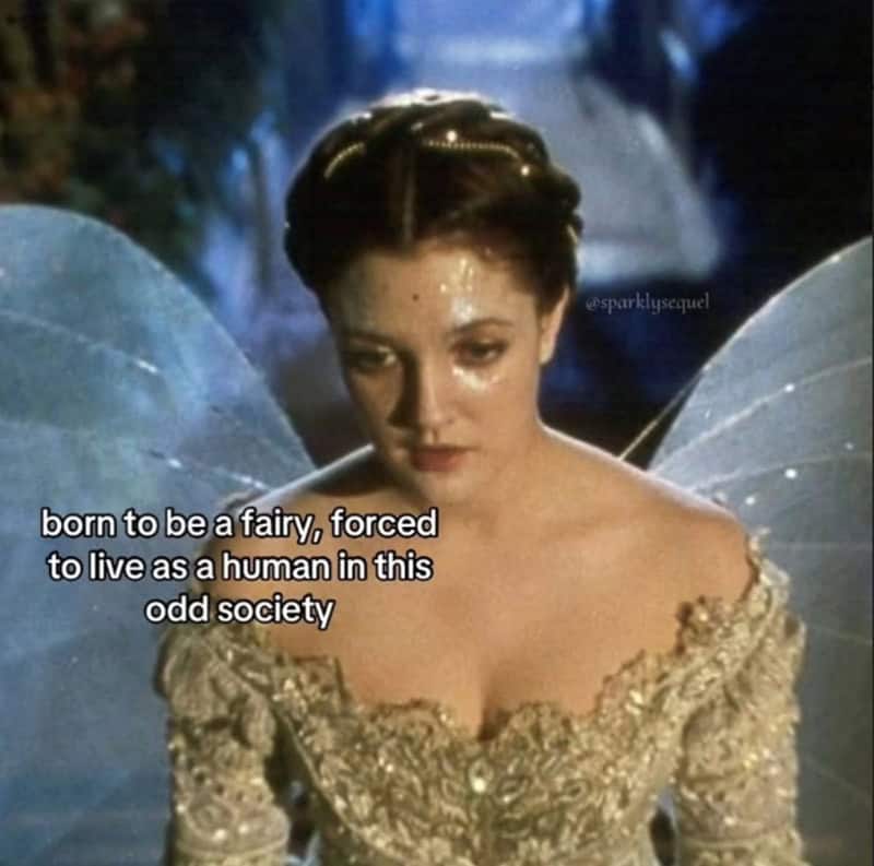 Drew Barrymore in Ever After with text about being a fairy forced to live in society.