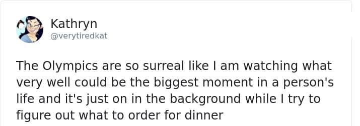 A funny winter olympics reaction tweet by Kathryn describing the surreal contrast between athletes having the biggest moment of their lives while viewers just decide what to order for dinner.