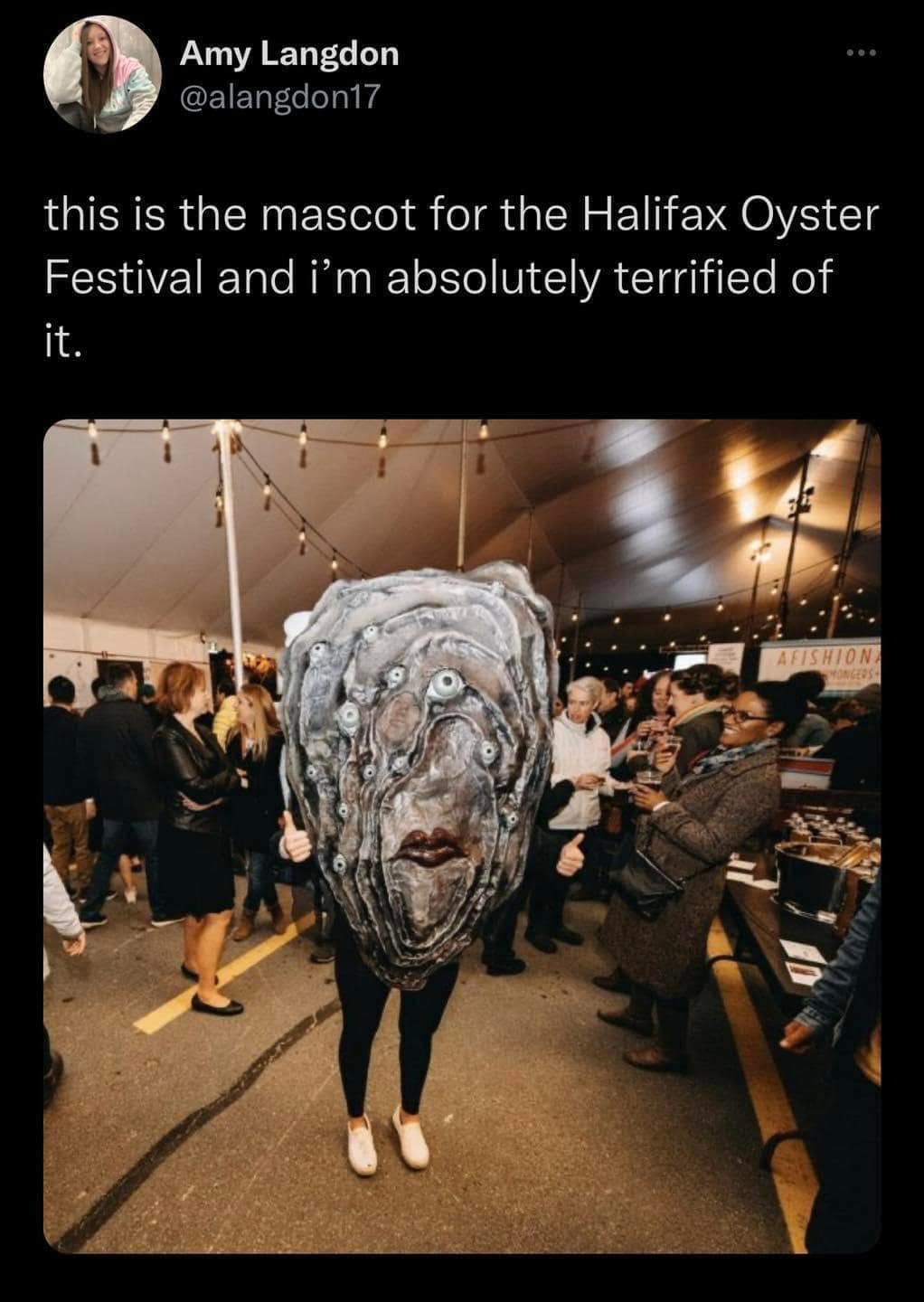 A classic meme featuring the terrifying, realistic mascot of the Halifax Oyster Festival, which looks like a sleep paralysis demon made of shellfish.