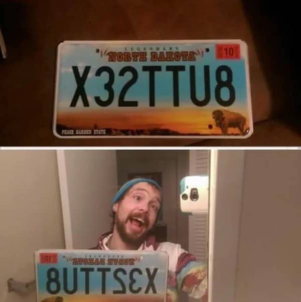 North Dakota license plate reading X32TTU8 which reflects in a mirror to spell a suggestive phrase.