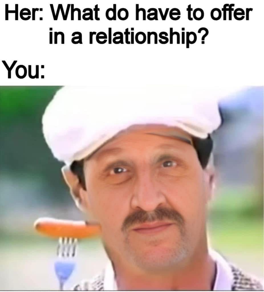 A hilarious meme response to "what do you have to offer" showing a man balancing a cooked sausage on a fork balanced on his mustache.