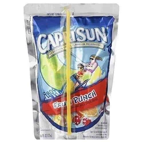 A Capri Sun Fruit Punch pouch with the yellow straw pierced through the top, a staple nostalgic drink found in countless school lunchboxes.