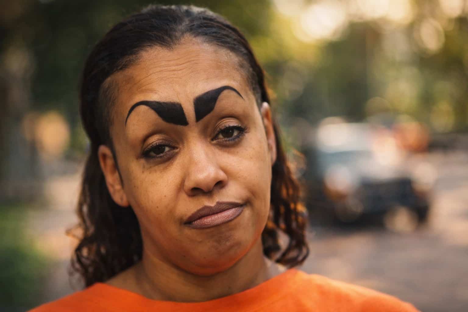 Close-up of a woman with dramatic, thick, black arched eyebrows for funny eyebrows gallery.