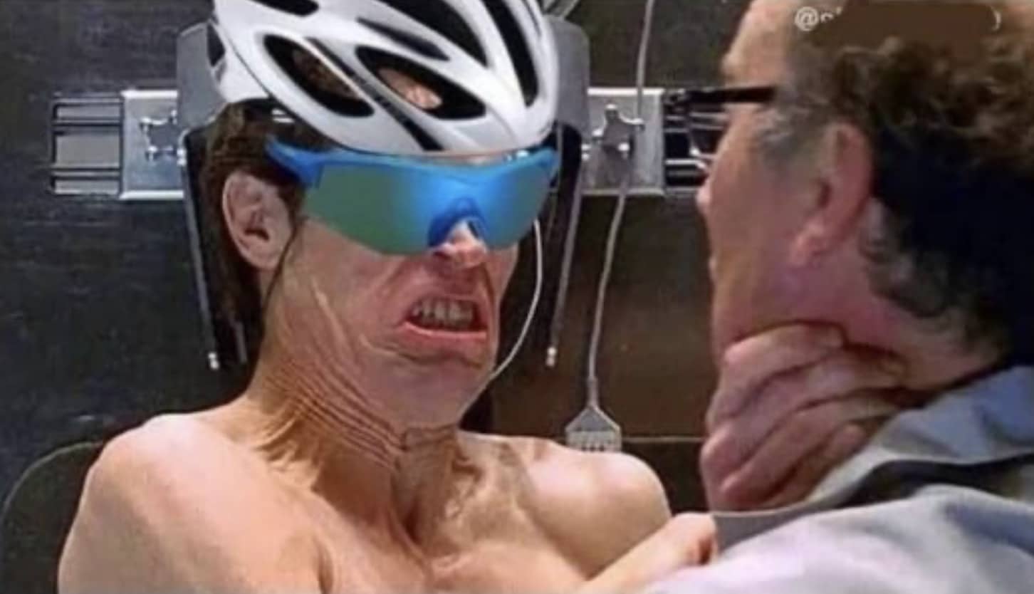 Willem Dafoe Green Goblin meme edited with a bicycle helmet and blue mirrored cycling sunglasses.