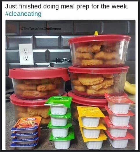 relatable meme dump kitchen counter scene where several glass meal prep containers are filled entirely with fast-food chicken nuggets. The image is crowded with stacks of McDonald’s and Kraft dipping sauces and ironically captioned, "Just finished doing meal prep for the week. #cleaneating."
