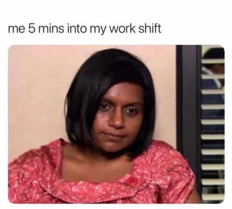 A funny work meme featuring Kelly Kapoor from The Office slumped in her chair with a vacant, defeated expression. The caption perfectly summarizes immediate professional burnout: "me 5 mins into my work shift."