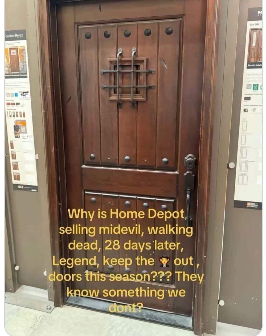 A funny home-improvement conspiracy meme from a meme dump showing a heavy, fortress-style rustic mahogany door on display at Home Depot, built with medieval iron studs and a small barred speakeasy window. The overlay text jokes that the store is quietly preparing humanity for a zombie apocalypse or vampire invasion.