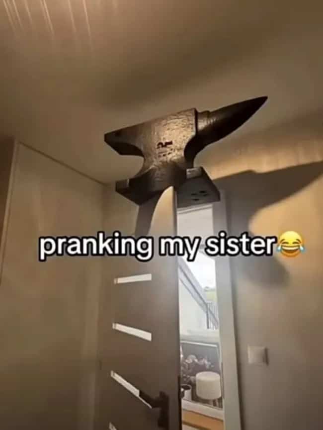 Heavy anvil balanced precariously on top of an open door prank meme.