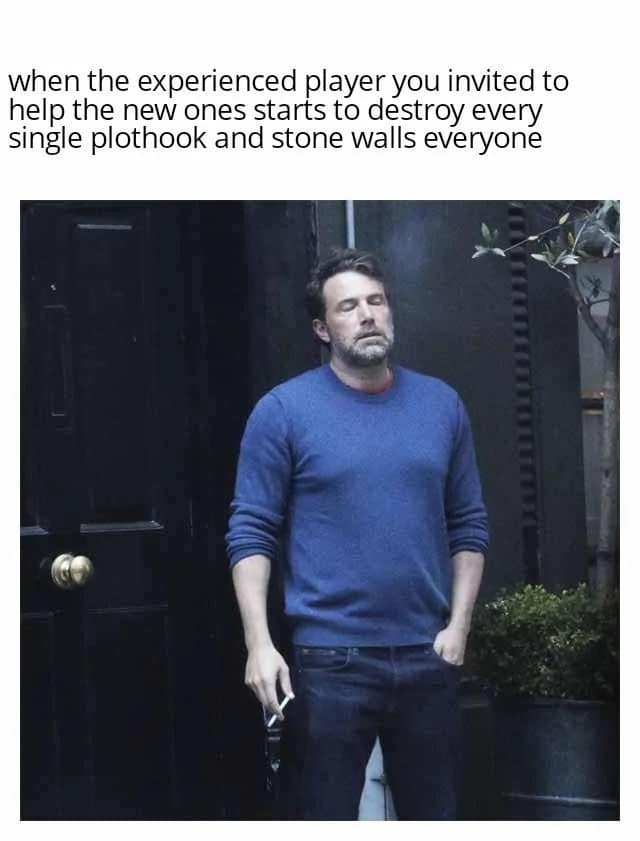 Photo of an exhausted Ben Affleck smoking a cigarette outside, capturing a Dungeon Master's despair when an experienced player ruins the campaign for new players.