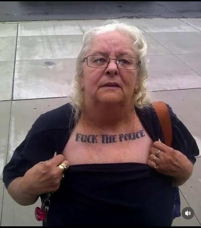 Wild funny memes post featuring an elderly woman revealing her explicit collarbone tattoo.