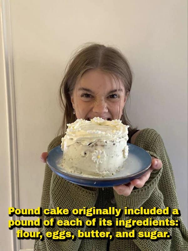 A woman holding a decorated white frosted cake with small sugar daisies and taking a bite, featuring a historical random fact explaining that original pound cake recipes called for a full pound each of flour, eggs, butter, and sugar.