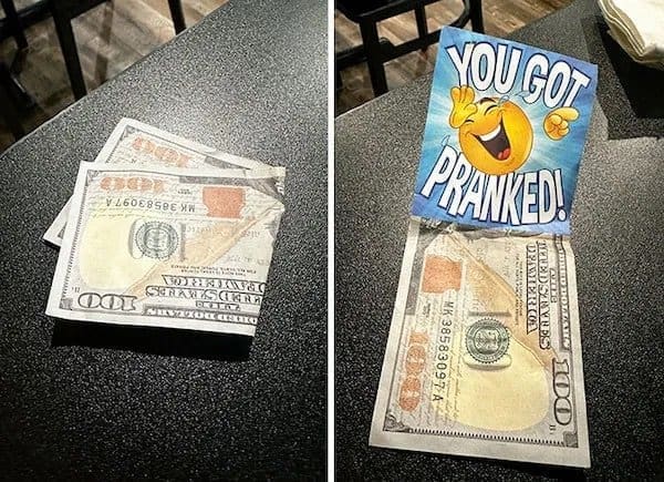 Folded fake hundred dollar bill left as a tip that opens to say you got pranked.
