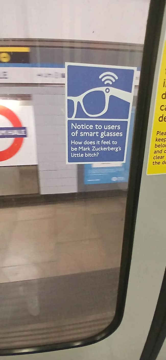 Fake transit notice on a London Underground door rudely mocking smart glasses users