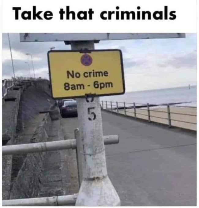 Seaside parking style sign reading No crime 8am to 6pm on a promenade