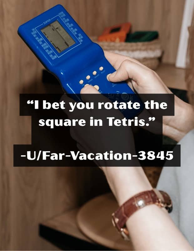 Hand playing a blue handheld game with an insult about rotating the square in Tetris