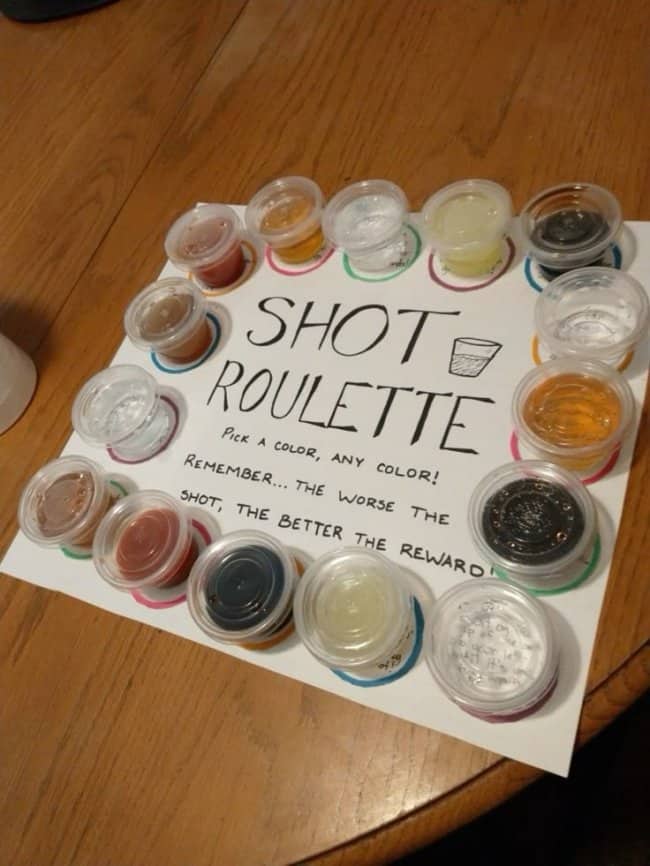 A custom Shot Roulette board with mystery liquid cups featured among funny drinking games.