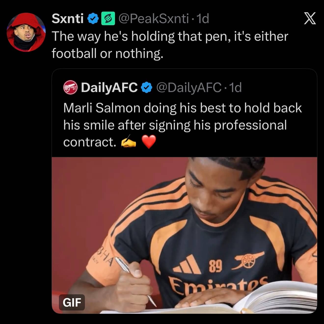 Funny football meme showing Marli Salmon holding a pen strangely while signing.