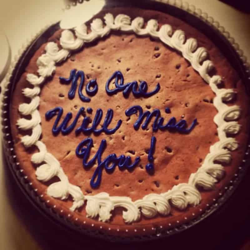 Giant cookie cake with blue icing reading No One Will Miss You