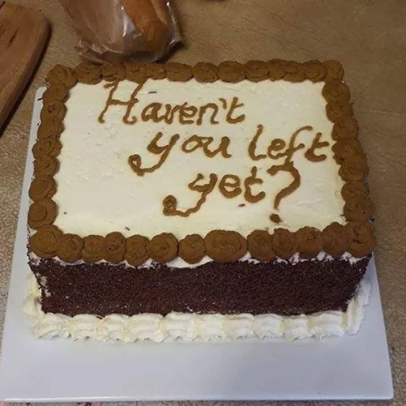 Square goodbye cake with brown piped letters asking haven't you left yet
