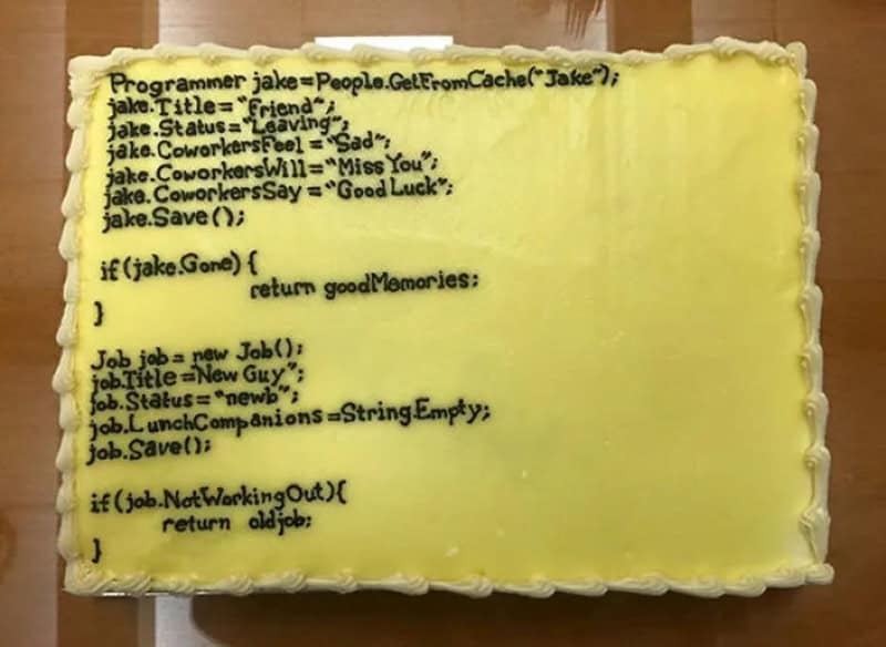 Farewell cake frosted with programming code saying goodbye to a coworker named Jake