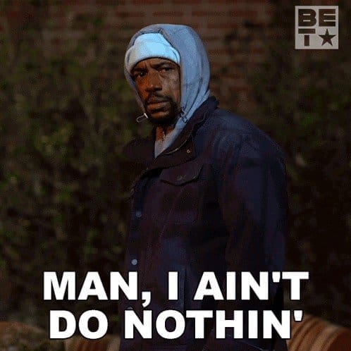 Man in a gray hoodie glaring at the camera over the caption man, I ain't do nothin'.