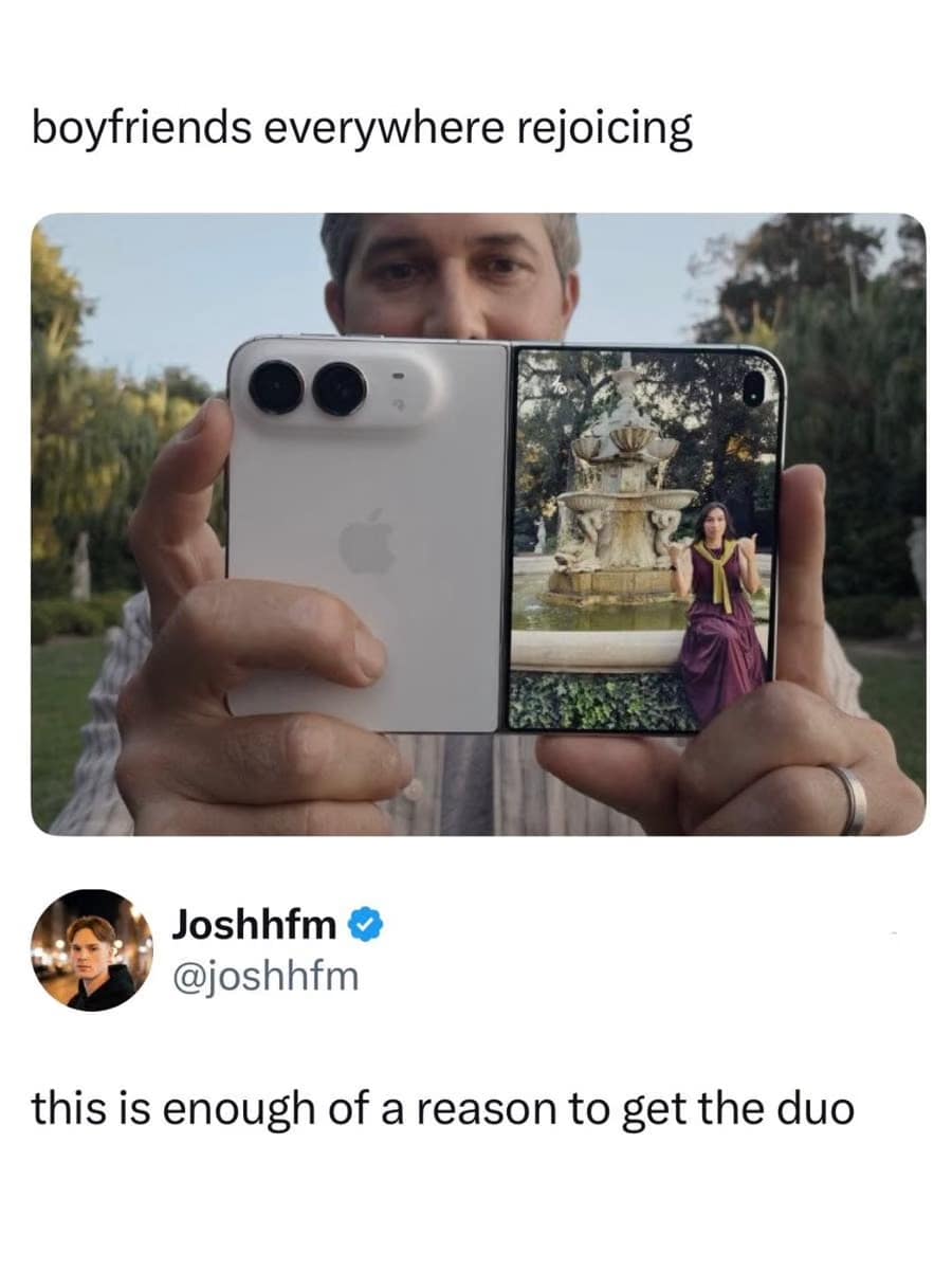 Hands holding the foldable iPhone Duo displaying a live camera preview of a girlfriend on the outer rear screen while taking her photo, shared as an iphone duo meme.
