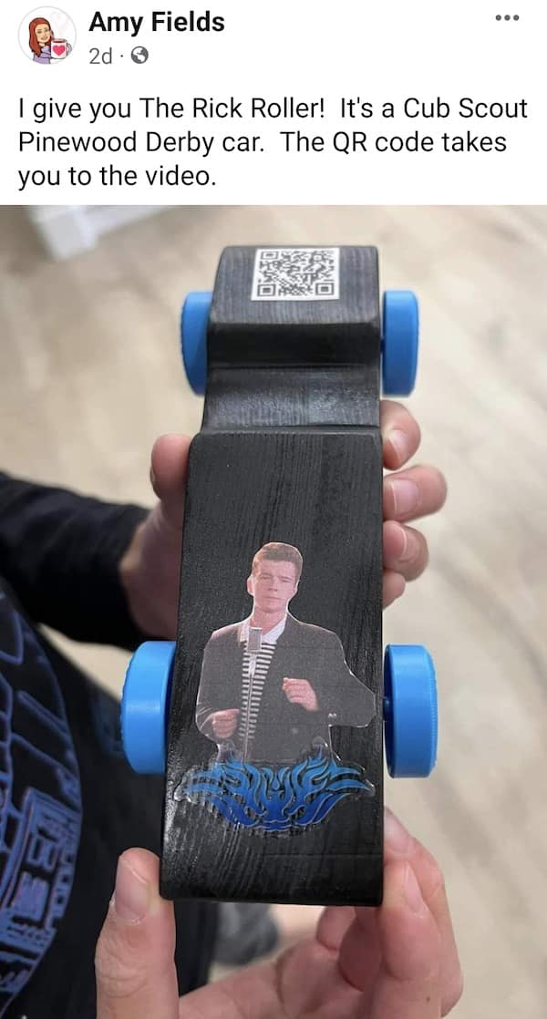 Cub Scout Pinewood Derby car named 'The Rick Roller' featuring a Rick Astley decal and a scannable QR code in a meme dump.
