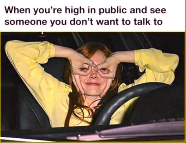 Meme dump pic of a woman making goggle hands in a car to dodge someone.