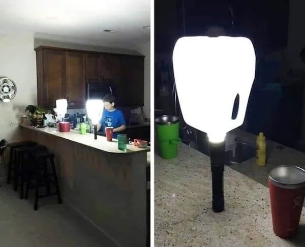 Milk jugs placed over flashlights to light up a kitchen counter during a power outage.