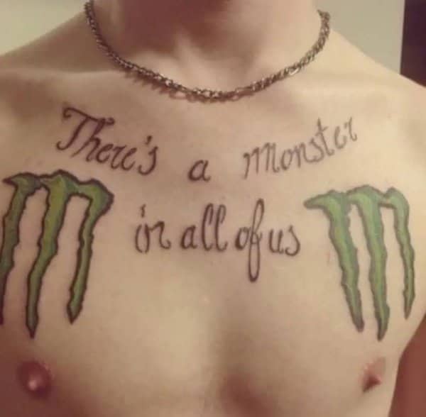 Chest tattoo reading There's a monster in all of us beside two Monster Energy logos
