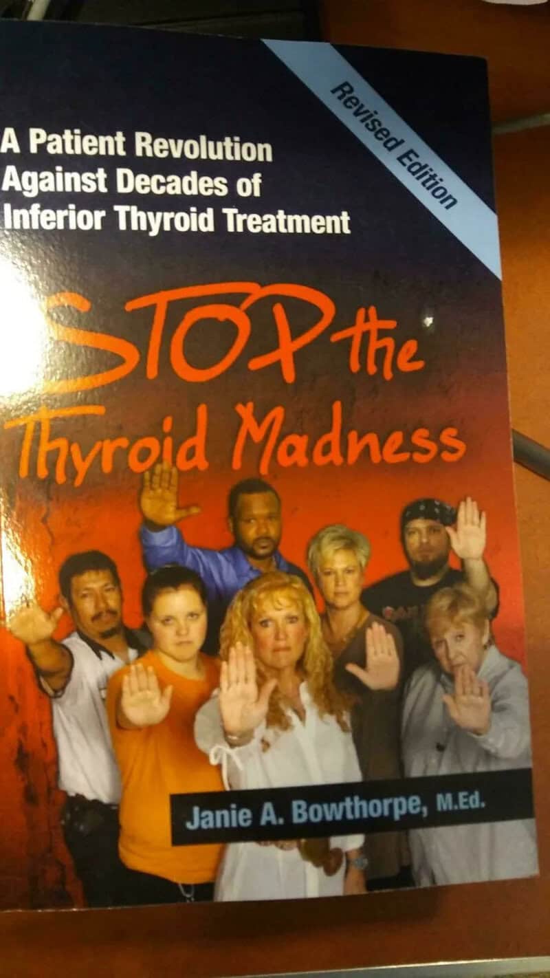 Health book Stop the Thyroid Madness showing a group of people raising their palms at the camera.