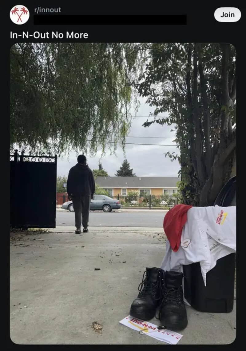 In-N-Out uniform and work boots left by a trash bin as the worker walks away