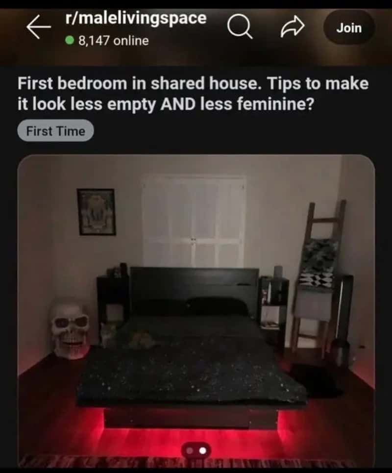 Dark bedroom with a giant skull and red lights, asking how to look less feminine